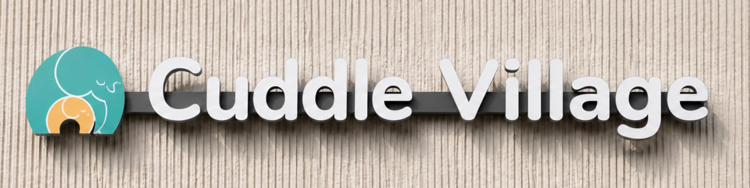 Cuddle Village physical signage